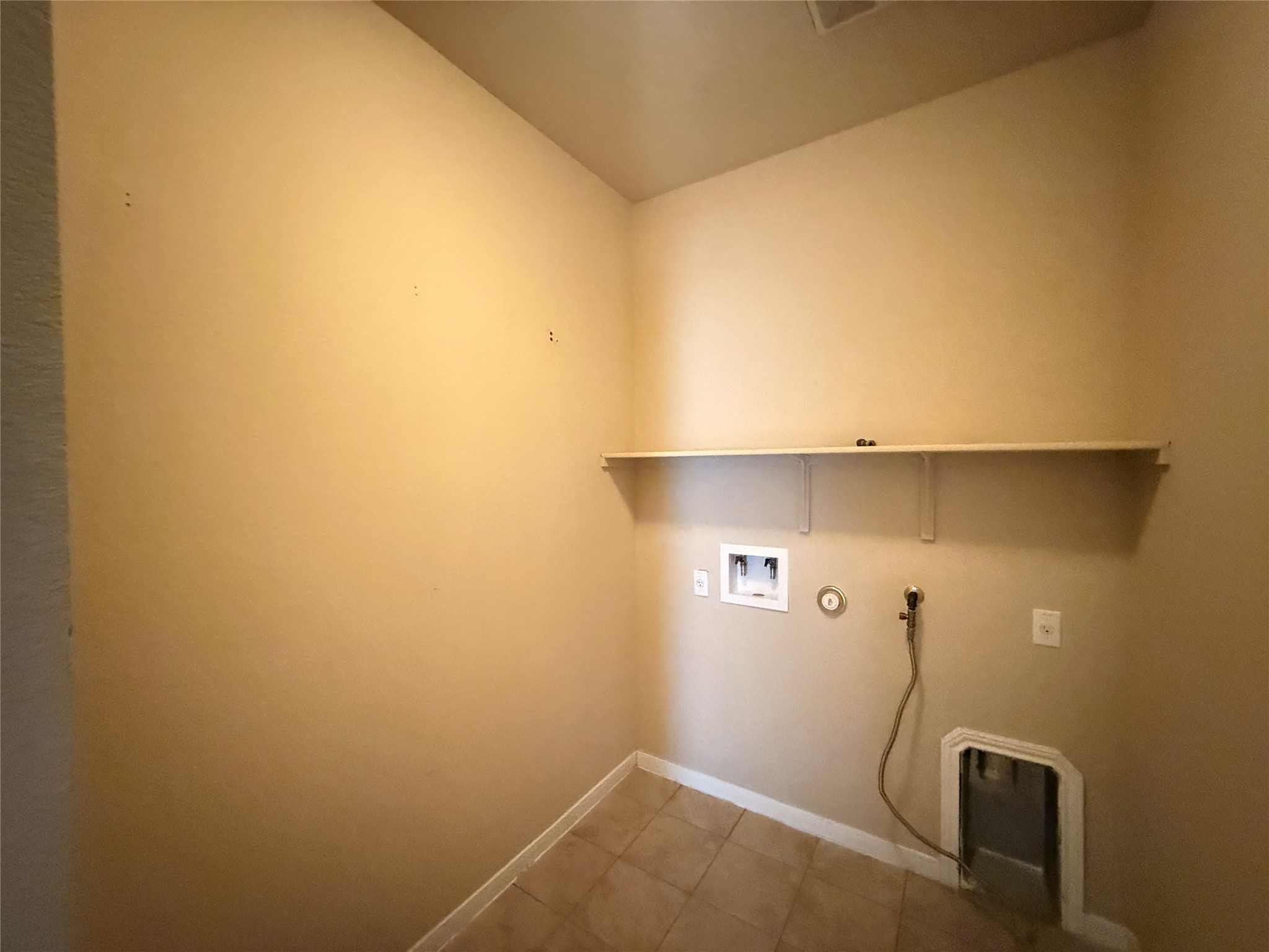 1602 Atlantica Street Cedar Park, TX 78613 - Photo 11 of 24 Laundry area with gas dryer hookup, hookup for a washing machine, and light tile patterned floors