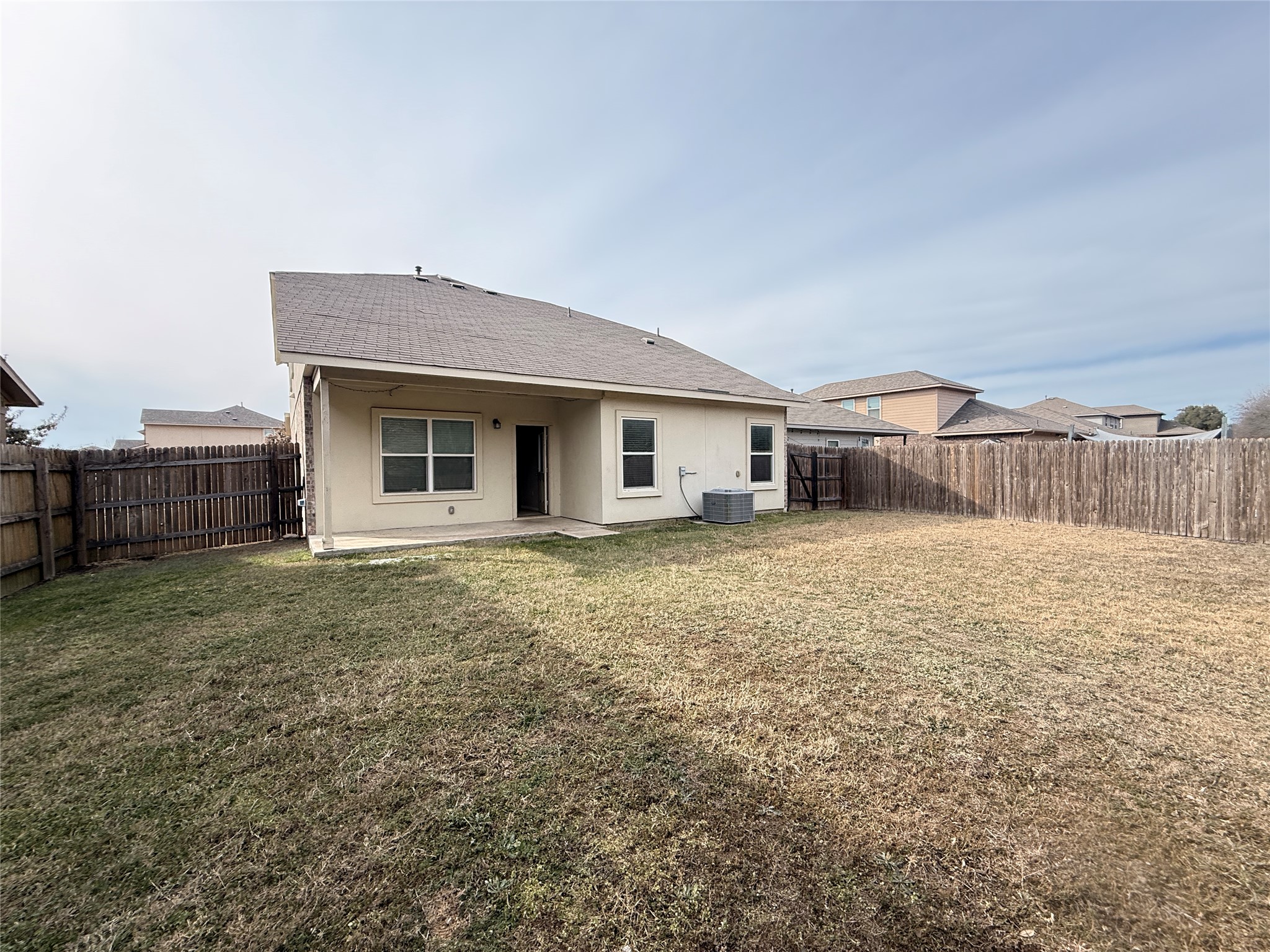 1602 Atlantica Street Cedar Park, TX 78613 - Photo 22 of 24 Back of house with a patio area, roof with shingles, and a fenced backyard