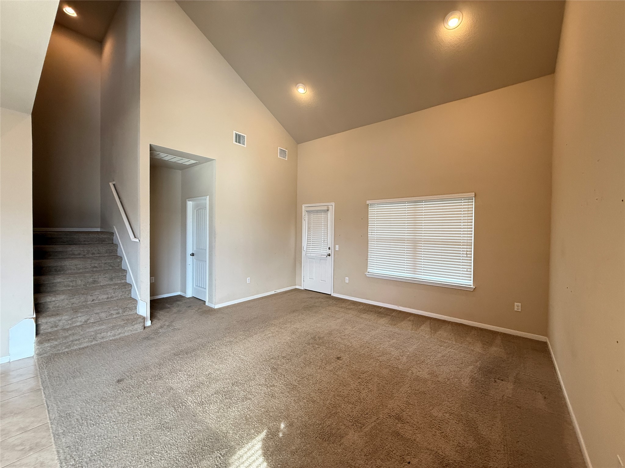 1602 Atlantica Street Cedar Park, TX 78613 - Photo 8 of 24 Unfurnished living room with recessed lighting, carpet, and lofted ceiling