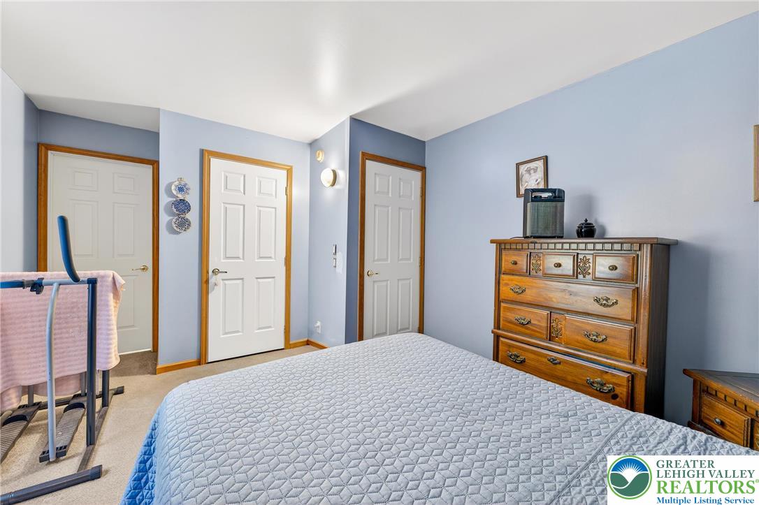 4859 Vera Cruz Road Emmaus, PA 18049 - Photo 12 of 23 a bedroom with a bed and a dresser