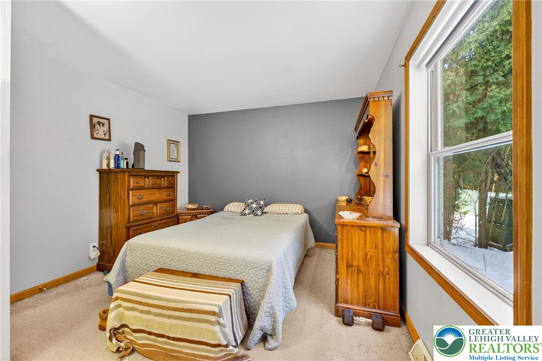 4859 Vera Cruz Road Emmaus, PA 18049 - Photo 13 of 23 a bedroom with a bed and a window