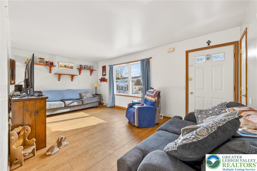 4859 Vera Cruz Road Emmaus, PA 18049 - Photo 4 of 23 a living room with furniture and a flat screen tv