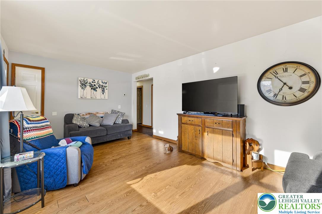 4859 Vera Cruz Road Emmaus, PA 18049 - Photo 6 of 23 a living room with furniture and a flat screen tv