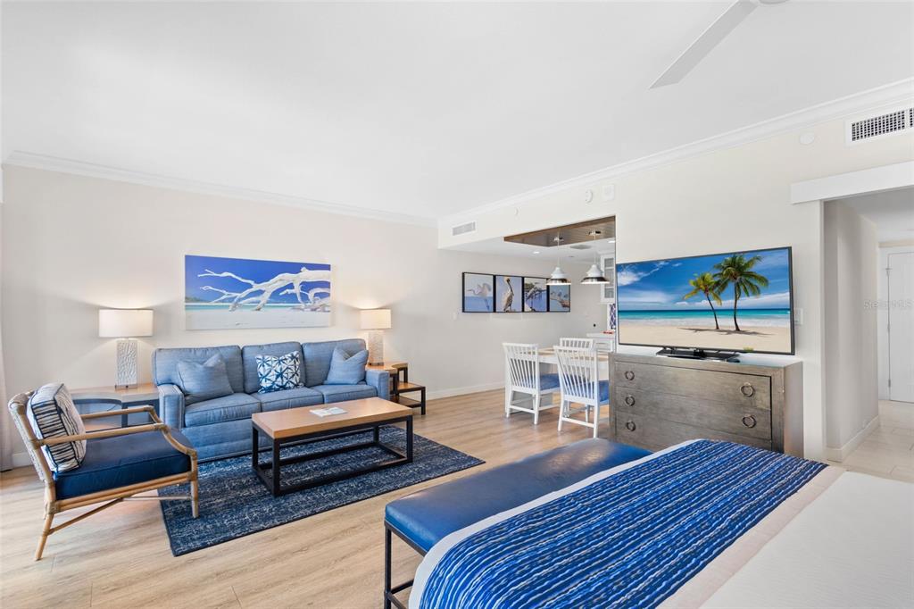 240 Sands Point Road, Unit 4104 Longboat Key, FL 34228 - Photo 9 of 47 a living room with furniture and a wooden floor