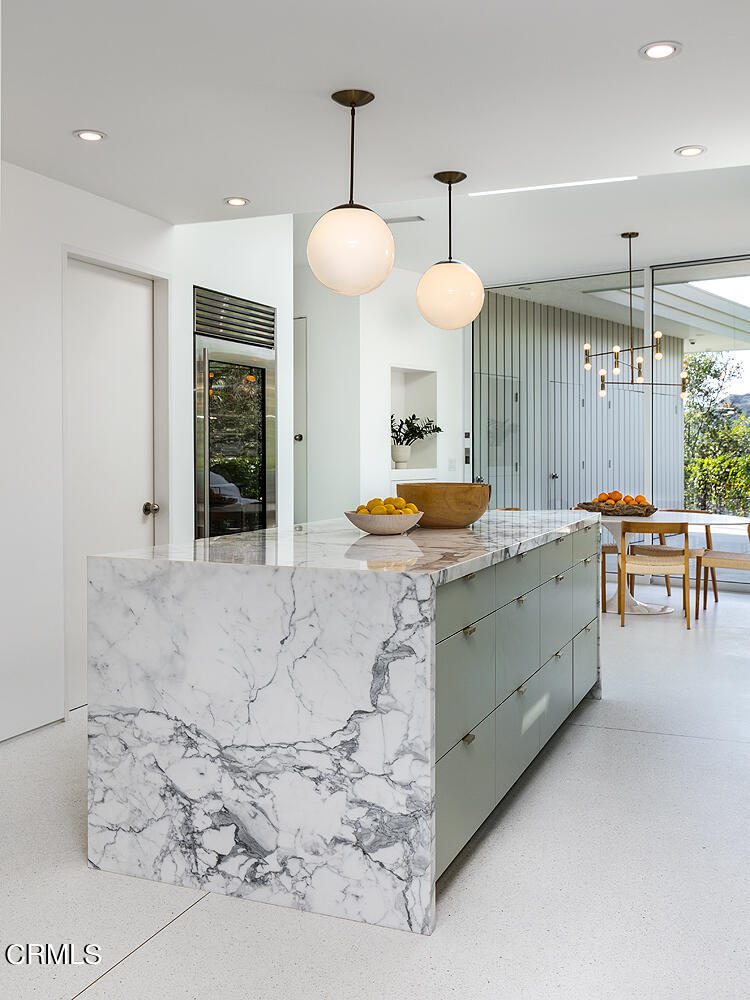 95 Tustin Road Pasadena, CA 91105 - Photo 15 of 41 a large kitchen with a table and chairs