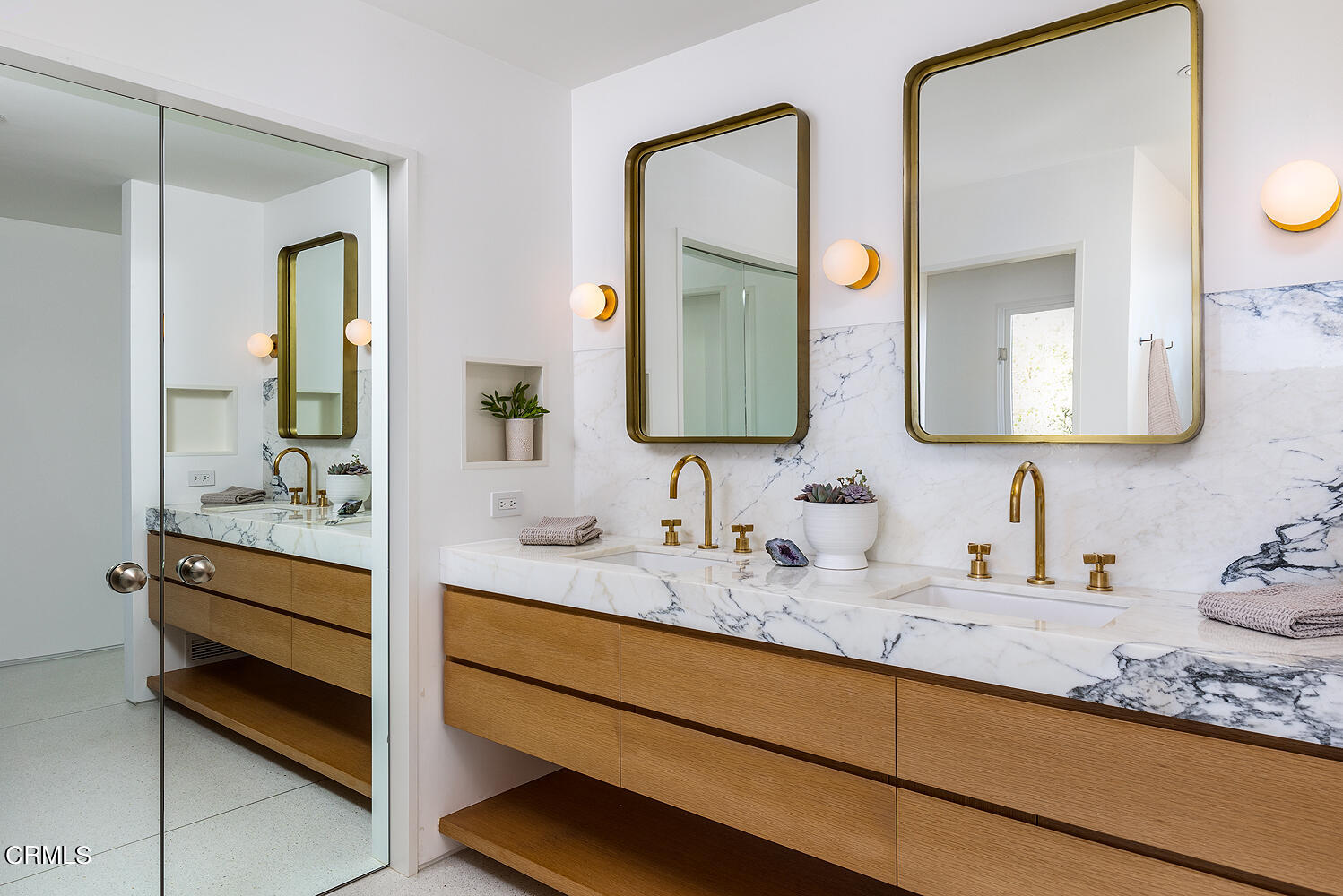 95 Tustin Road Pasadena, CA 91105 - Photo 23 of 41 a bathroom with double vanity sinks and a mirror