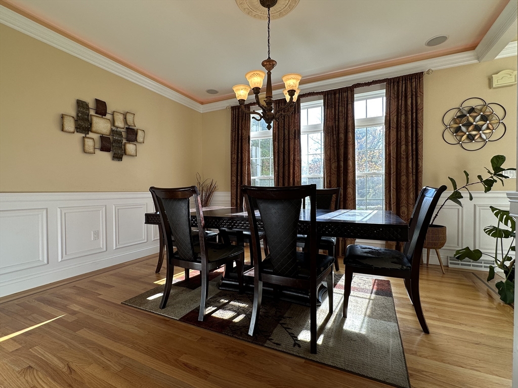 7 Rising Corner Road Southwick, MA 01077 - Photo 14 of 42 a view of a dining room with furniture window and wooden floor