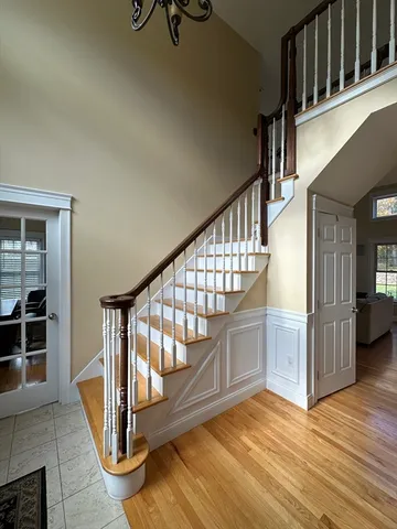 a view of an entryway with wooden floor