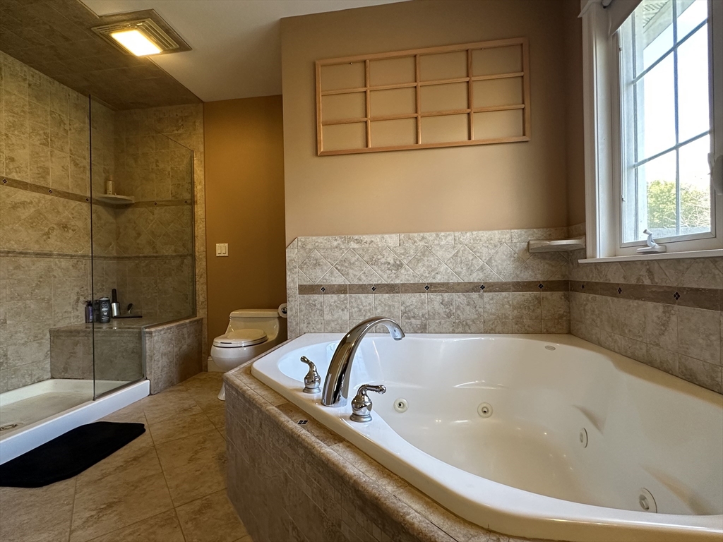 7 Rising Corner Road Southwick, MA 01077 - Photo 20 of 42 a bathroom with a bathtub and a shower