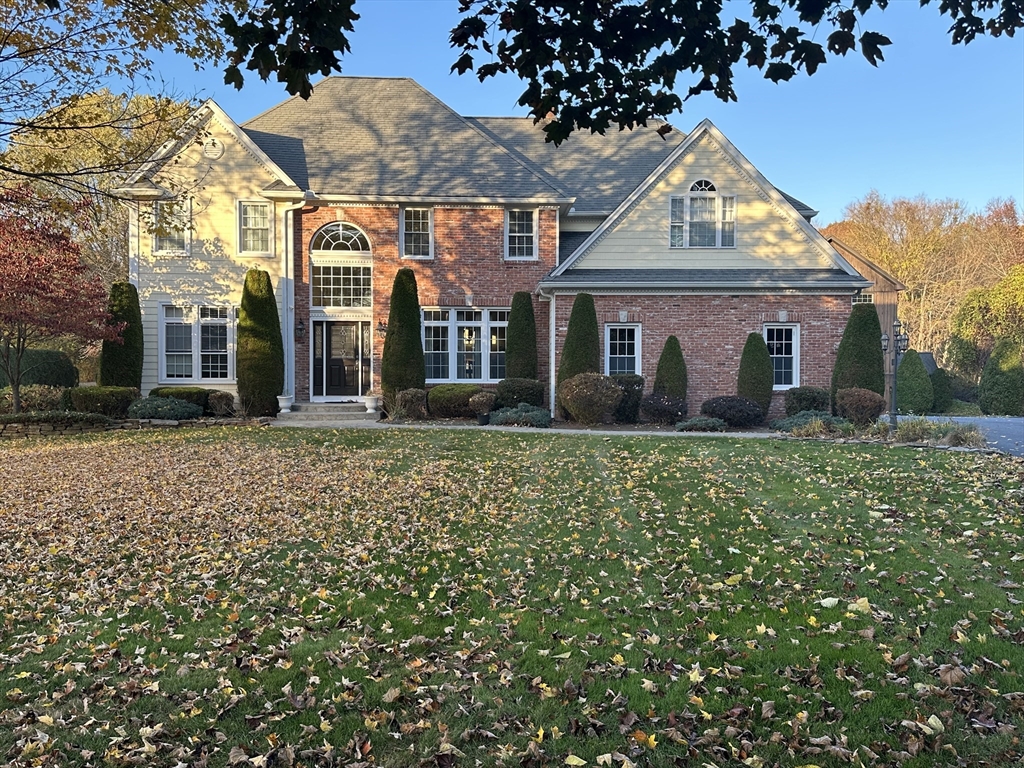 7 Rising Corner Road Southwick, MA 01077 - Photo 2 of 42 front view of a house with a garden