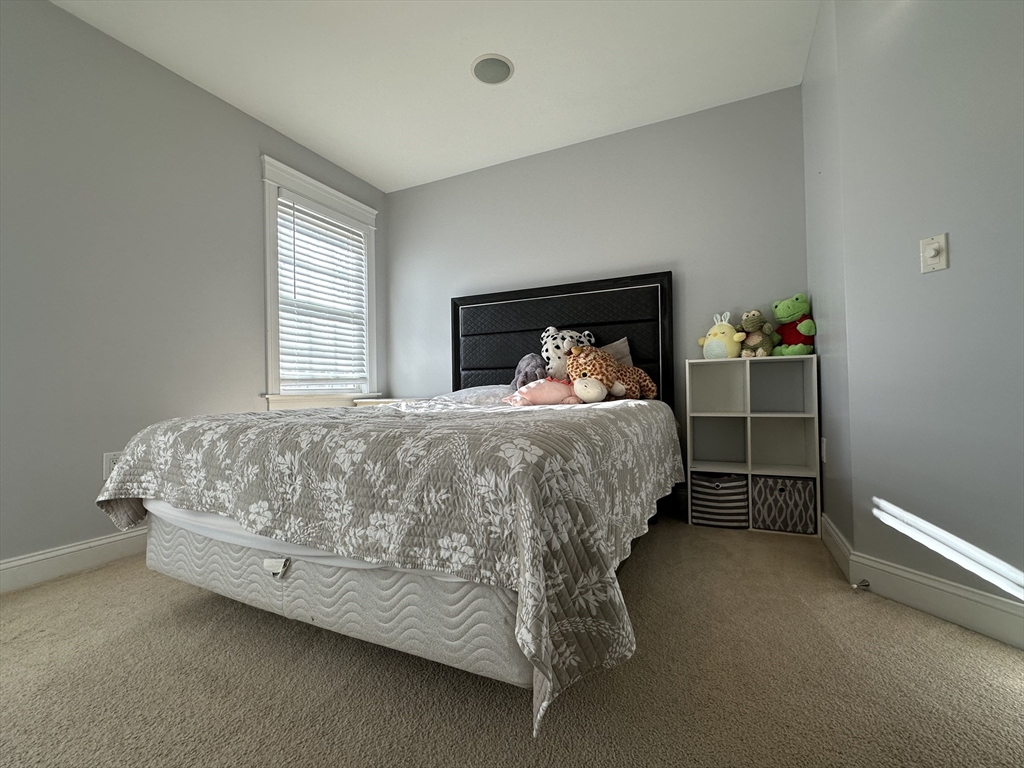 7 Rising Corner Road Southwick, MA 01077 - Photo 23 of 42 a bedroom with a bed and a window