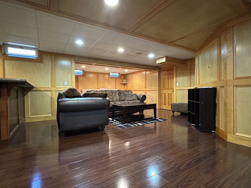 7 Rising Corner Road Southwick, MA 01077 - Photo 26 of 42 a living room with furniture and a wooden floor