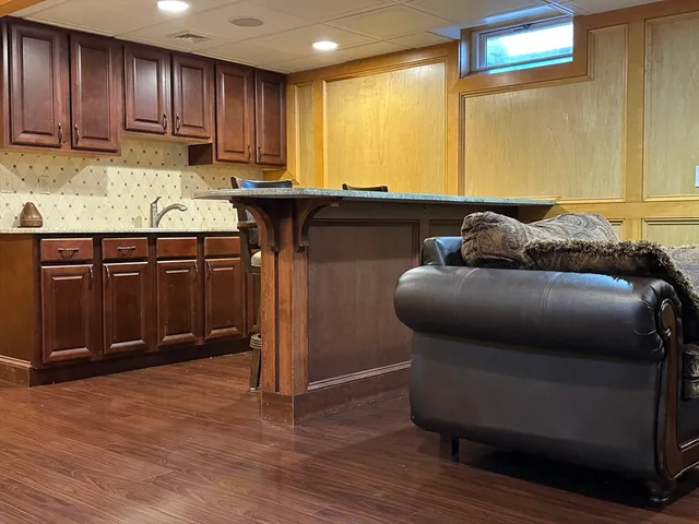 a kitchen with a sink and a refrigerator