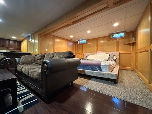 a bedroom with a bed and a night stand