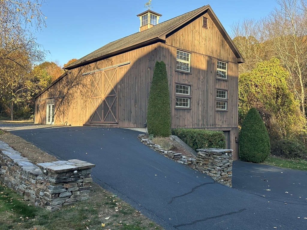 7 Rising Corner Road Southwick, MA 01077 - Photo 40 of 42 a backyard view of a house