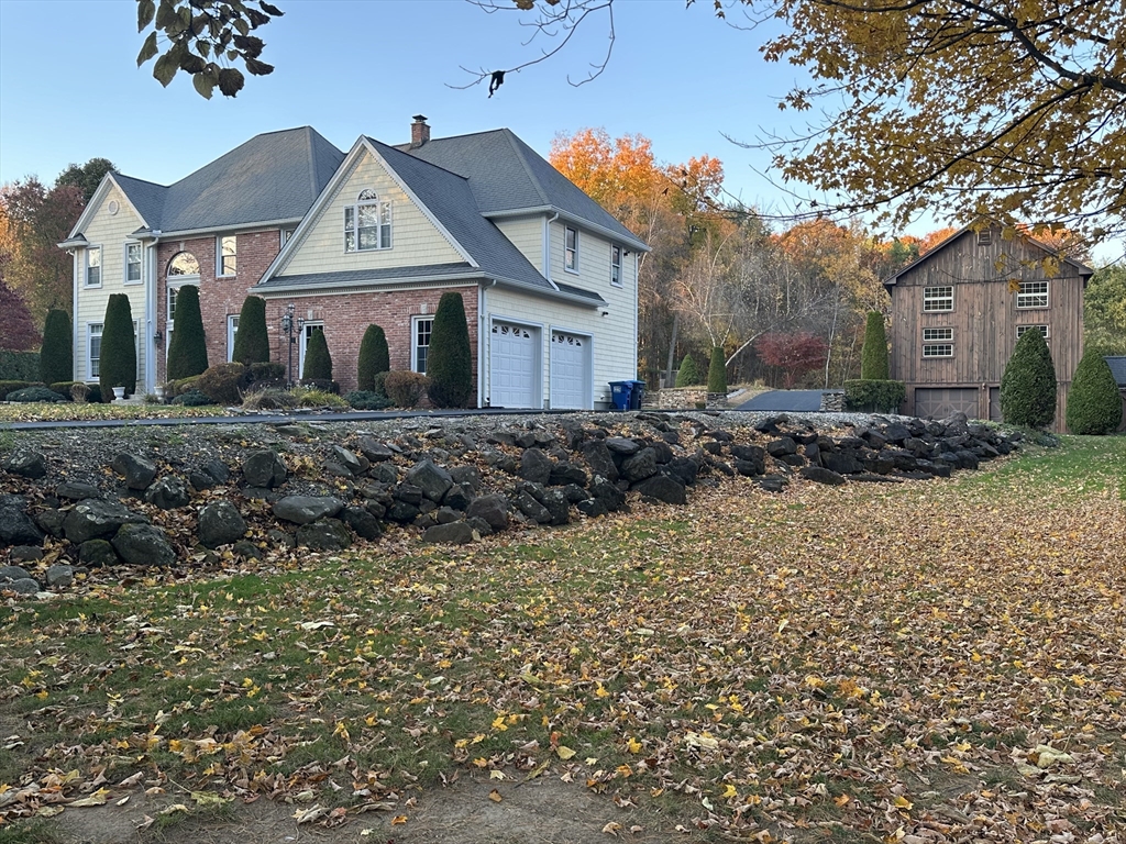 7 Rising Corner Road Southwick, MA 01077 - Photo 5 of 42 a view of a house with a yard
