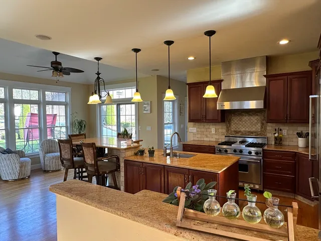 a large kitchen with lots of counter space windows and appliances