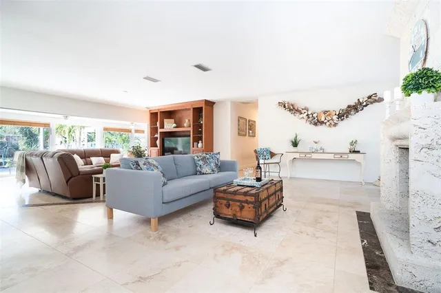 a kitchen with stainless steel appliances granite countertop a refrigerator stove microwave and sink