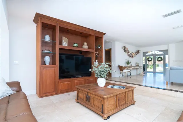 a bathroom with a granite countertop sink a toilet and a mirror