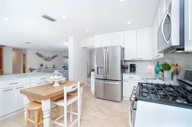 a bathroom with a granite countertop sink toilet a mirror and shower
