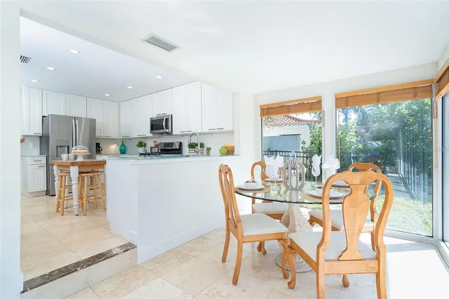 a balcony with furniture and a garden