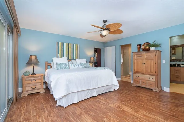 a view of a chairs and fire pit in backyard of a house