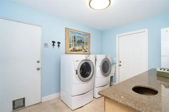 a view of swimming pool with a patio and a lake view