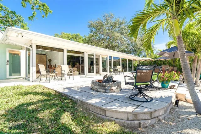 a view of a swimming pool with sitting area