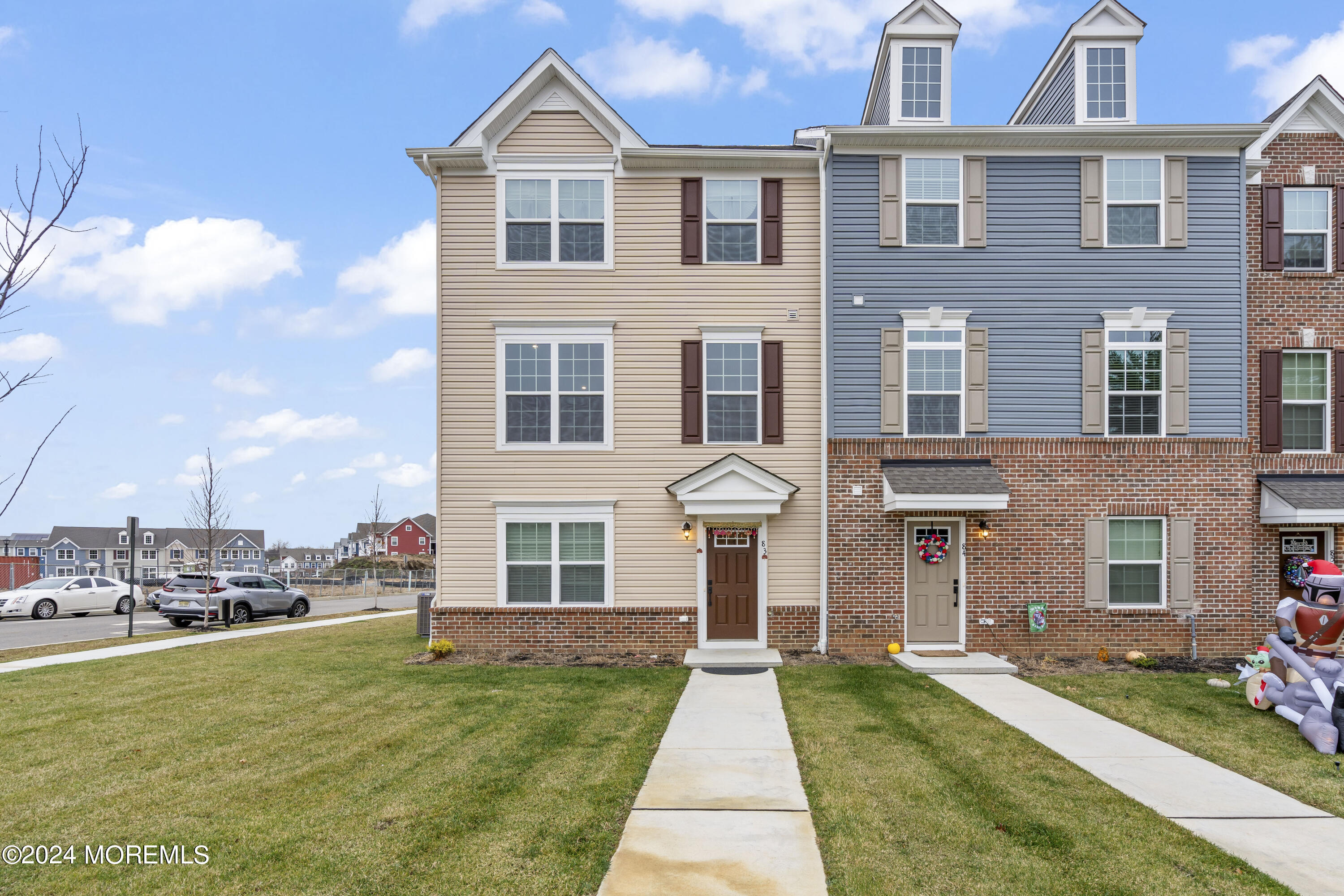 a front view of a building with a yard