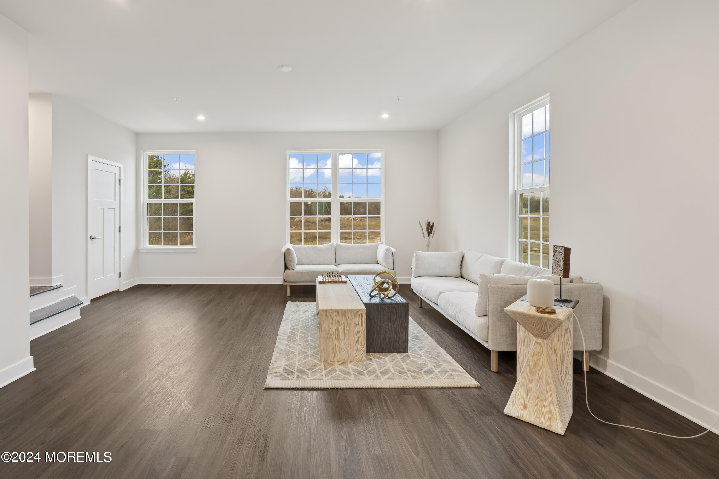 83 Anchor Way Cliffwood, NJ 07721 - Photo 11 of 27 a living room with furniture and wooden floor