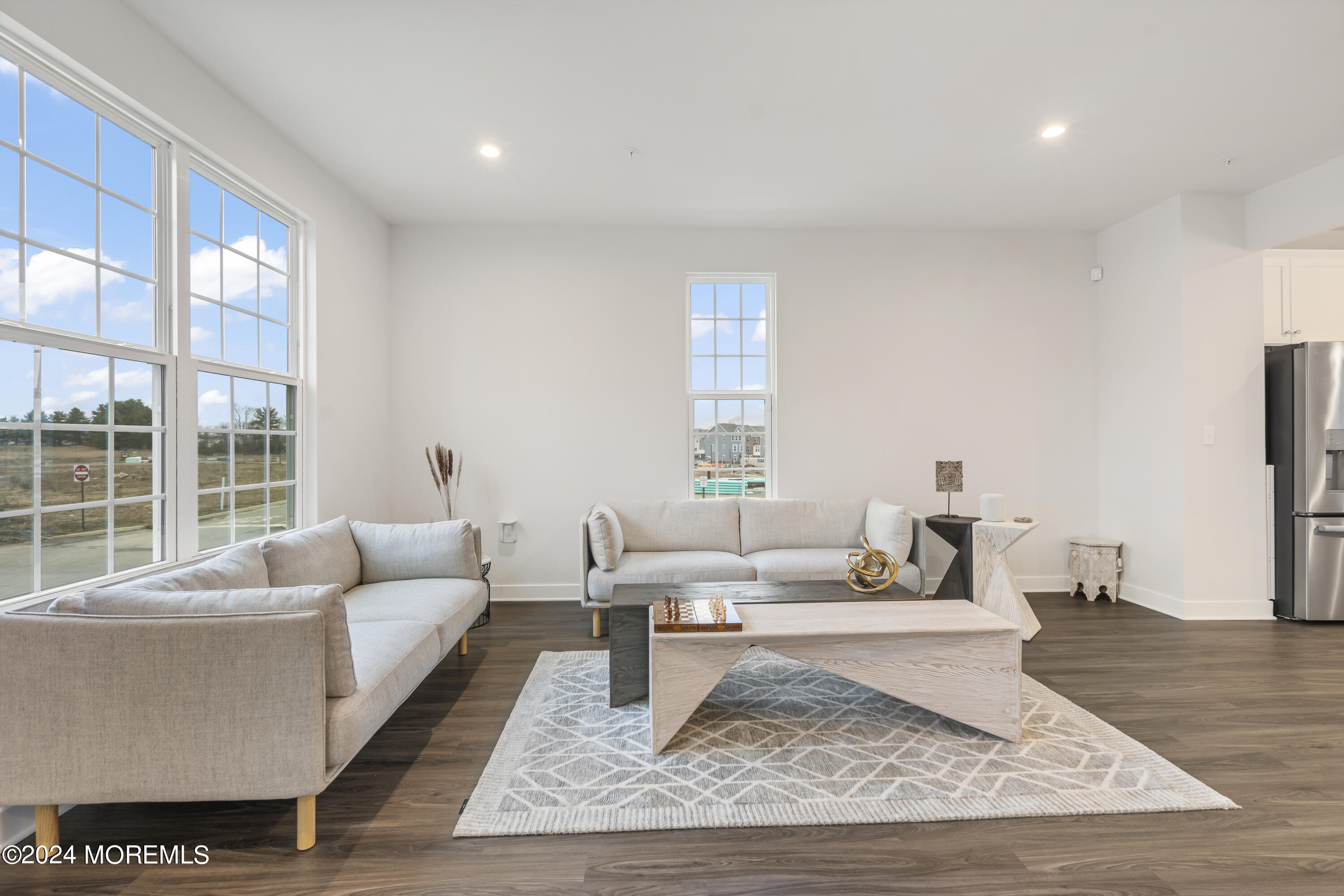 83 Anchor Way Cliffwood, NJ 07721 - Photo 12 of 27 a living room with furniture wooden floor and a rug