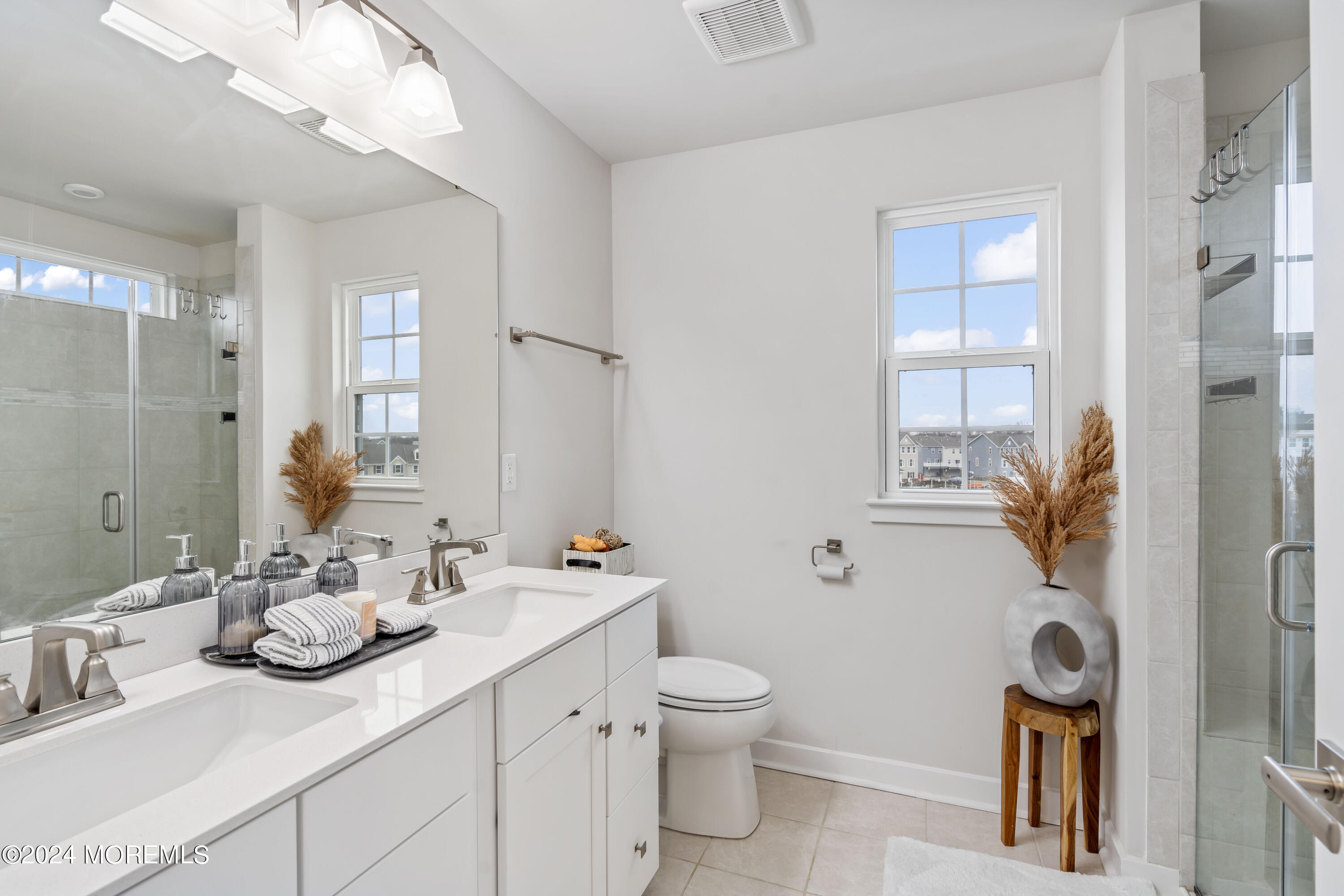 83 Anchor Way Cliffwood, NJ 07721 - Photo 19 of 27 a bathroom with a toilet sink and mirror