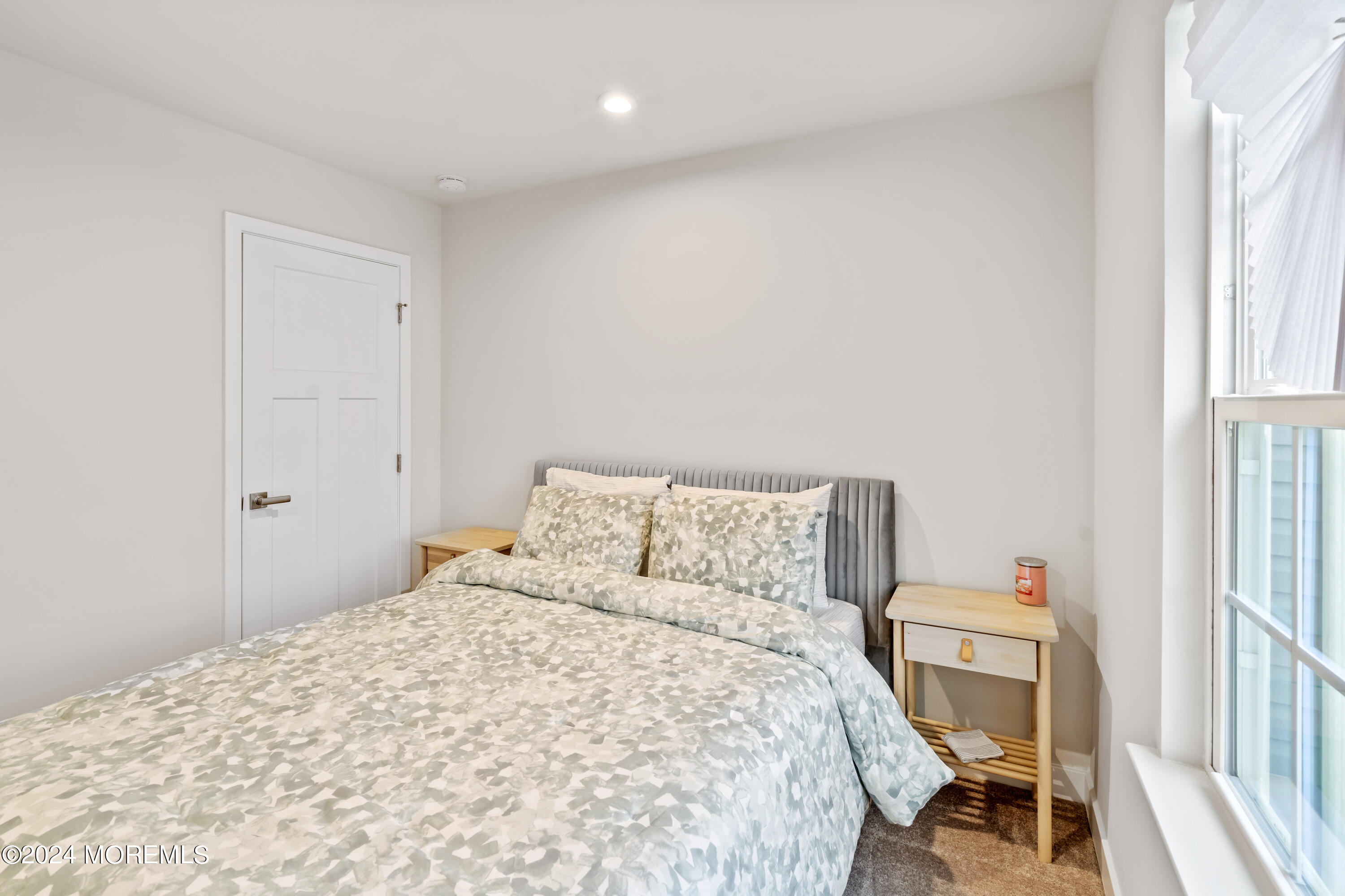 83 Anchor Way Cliffwood, NJ 07721 - Photo 21 of 27 a bedroom with a bed and a window