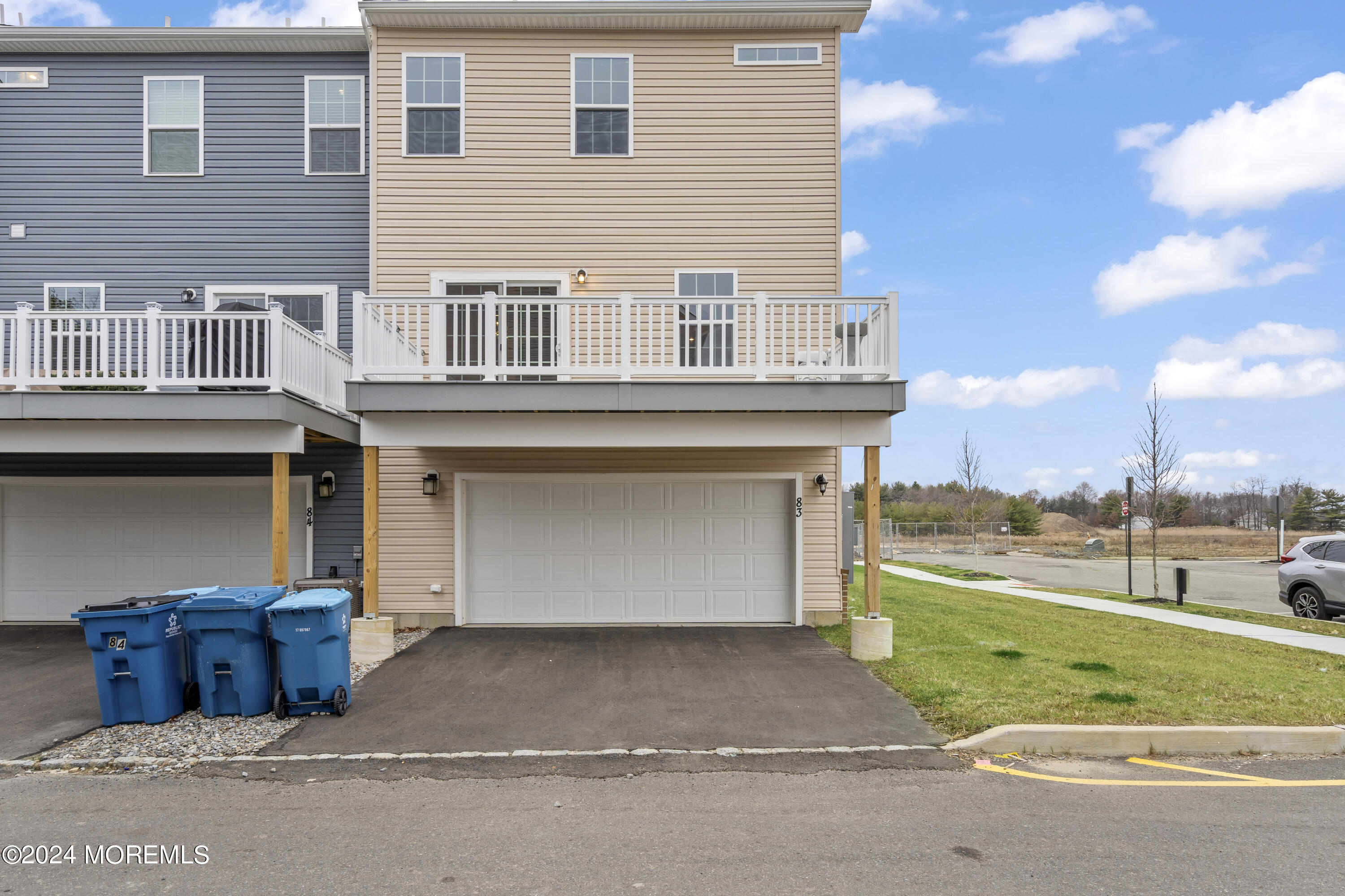 83 Anchor Way Cliffwood, NJ 07721 - Photo 3 of 27 a front view of a house with a yard and garage