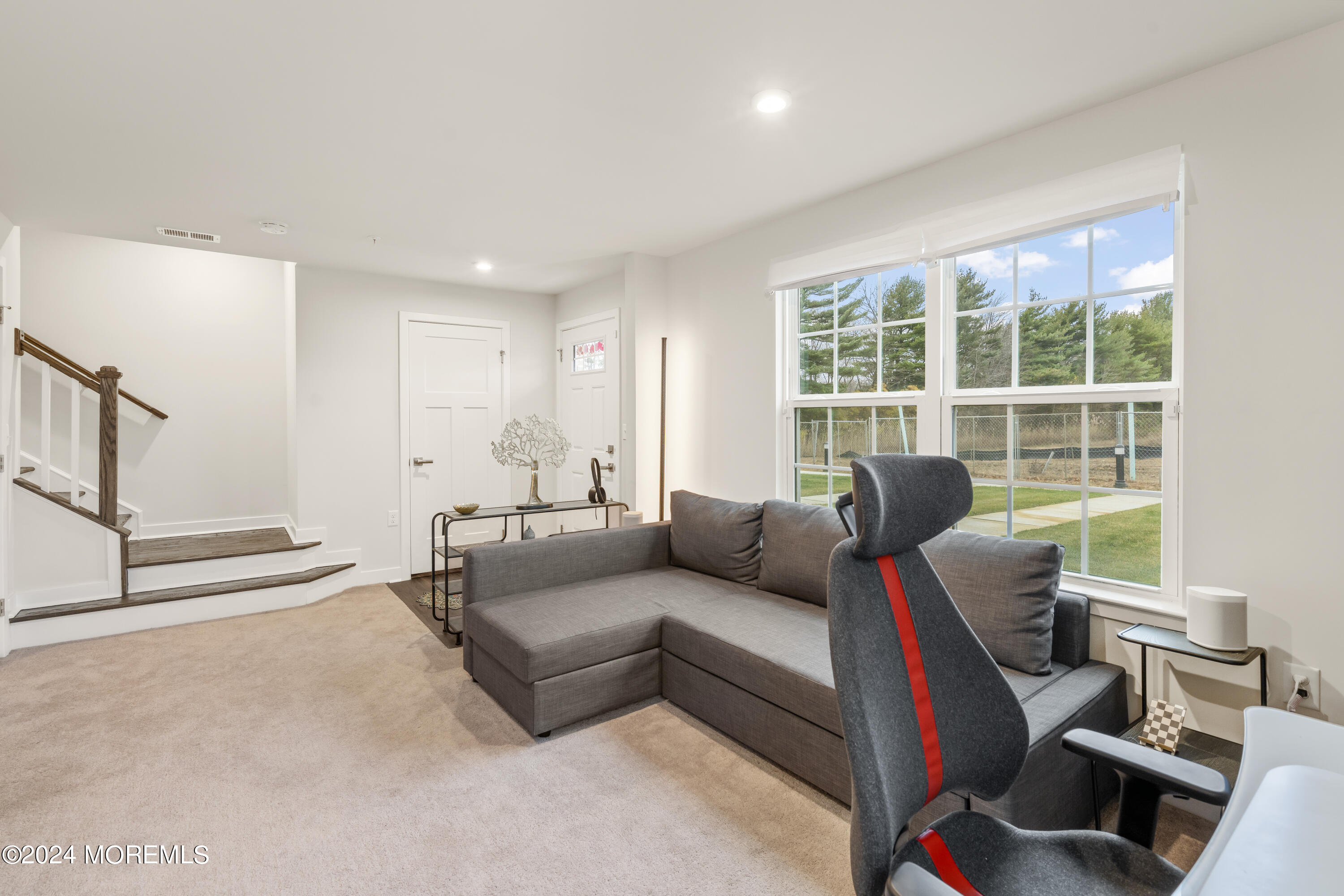 83 Anchor Way Cliffwood, NJ 07721 - Photo 5 of 27 a living room with furniture and a floor to ceiling window