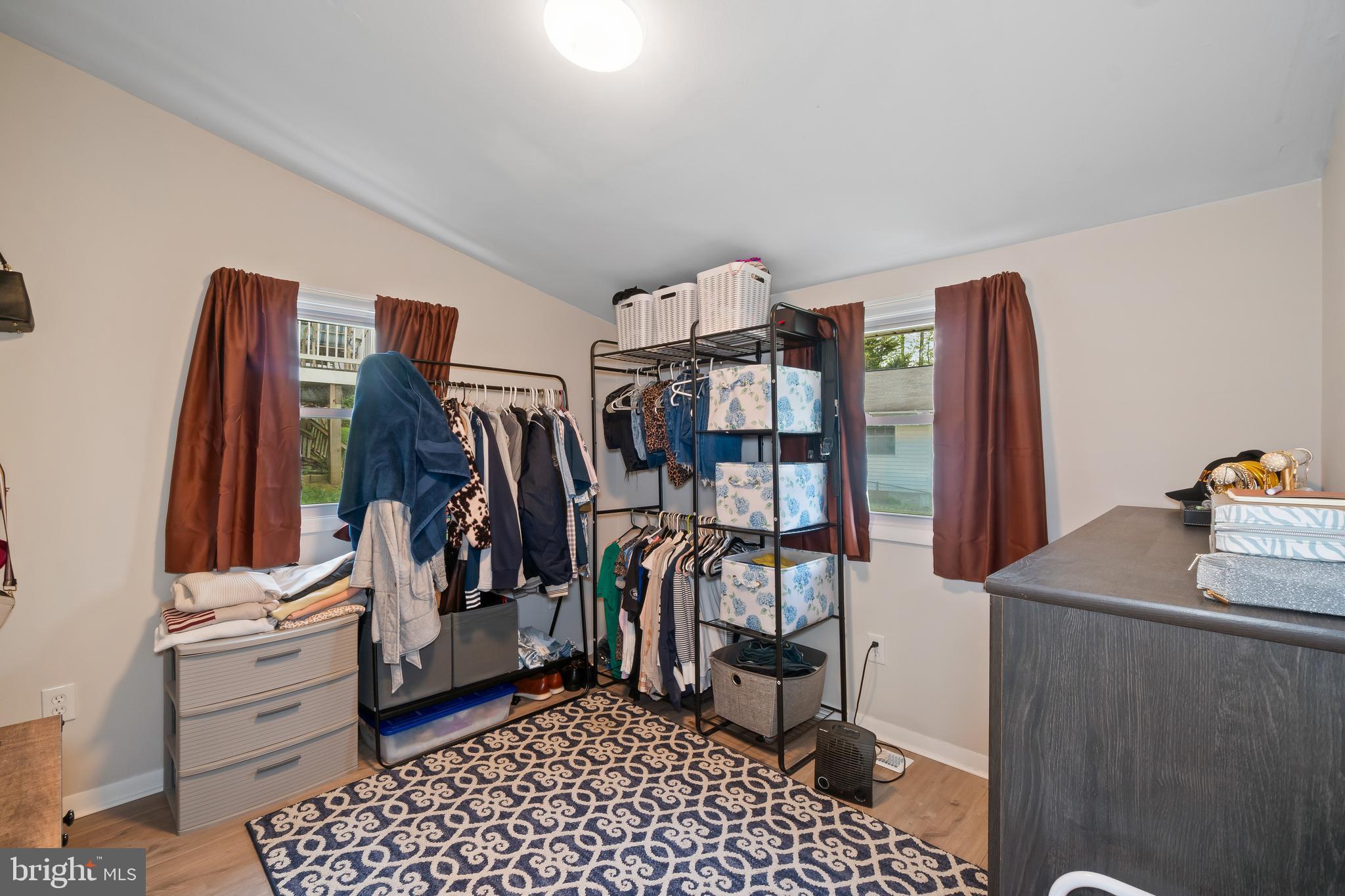 5 Dogwood Road Riva, MD 21140 - Photo 23 of 40 a view of walk in closet with clothes and shoes