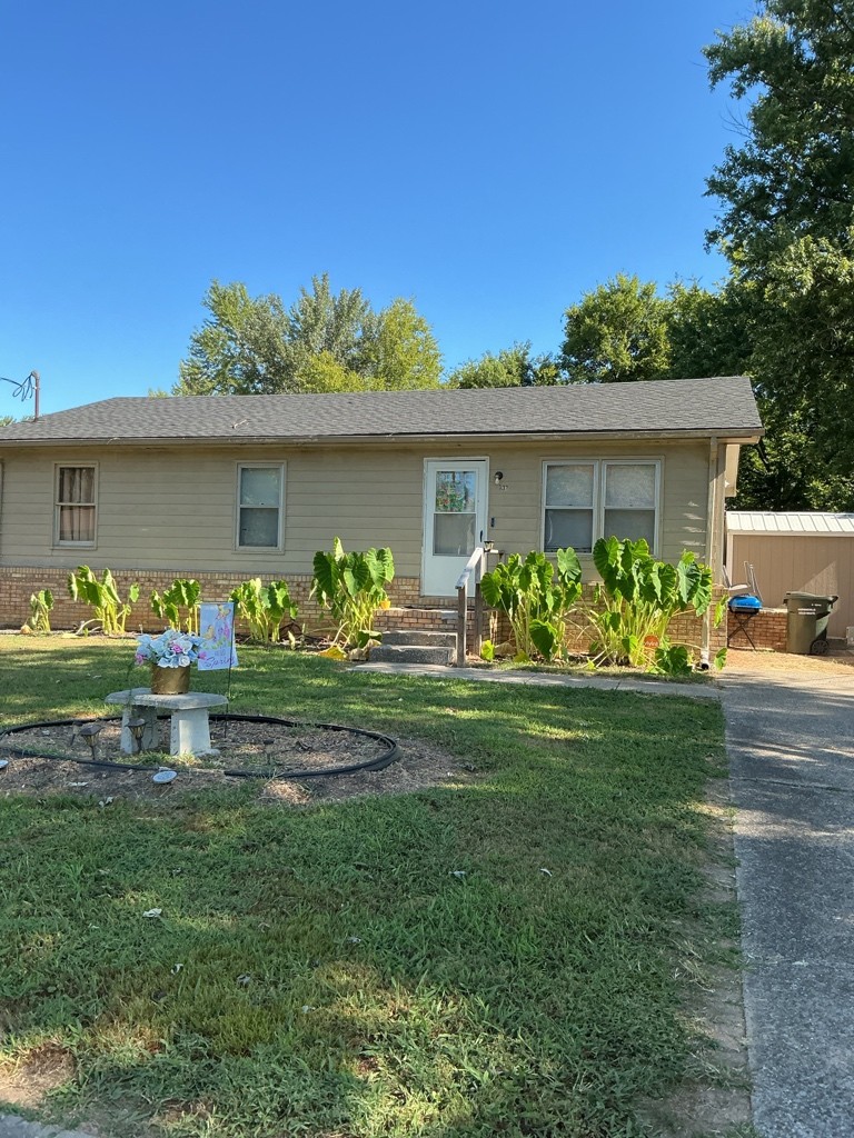 137 Boxwood Drive Hopkinsville, KY 42240 - Photo 1 of 1 a front view of a house with garden