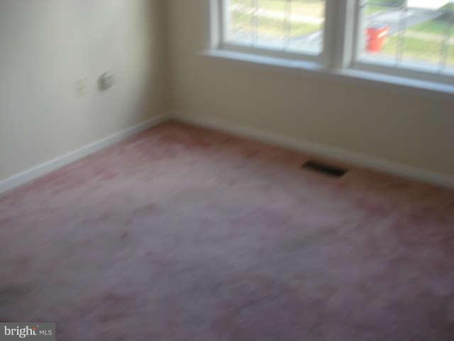 104 Limited Drive Ranson, WV 25438 - Photo 9 of 13 a view of an empty room with a window