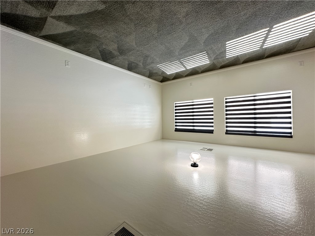 6784 Pivot Point Street Las Vegas, NV 89148 - Photo 23 of 27 A well-lit, open interior space awaits customization with sleek windows.