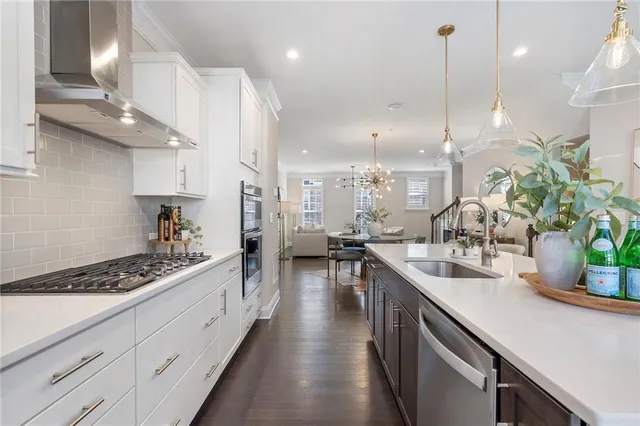 a kitchen with counter top space cabinets and stainless steel appliances