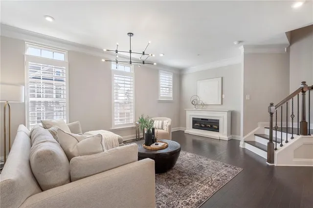 a living room with furniture fireplace and window