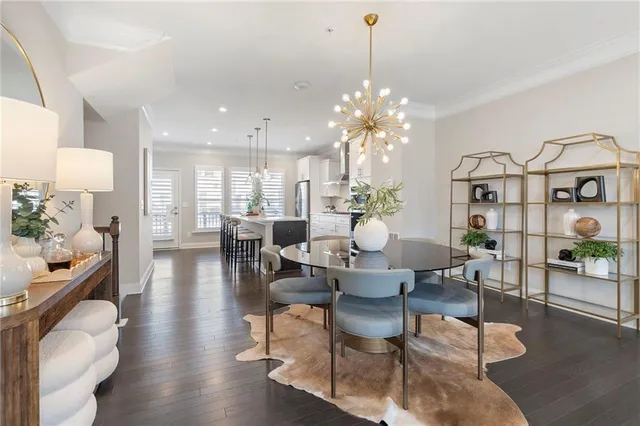 a living room with fireplace furniture and a chandelier