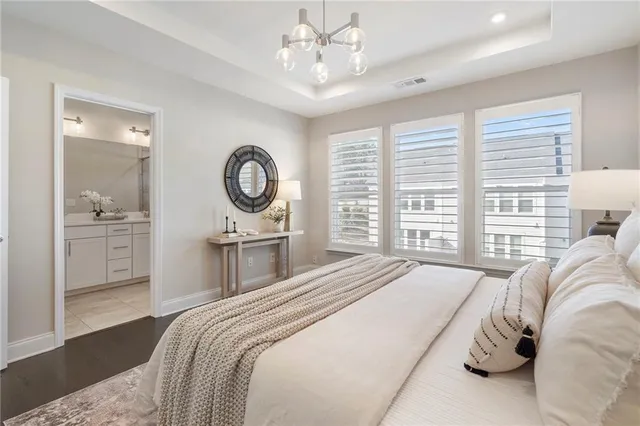 a bedroom with double bed and a window