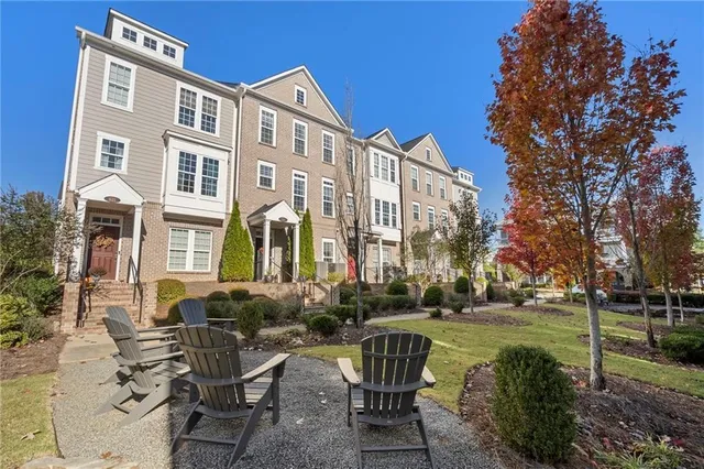 a view of a brick building with a yard