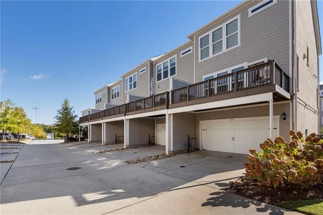 a front view of a building with a garden