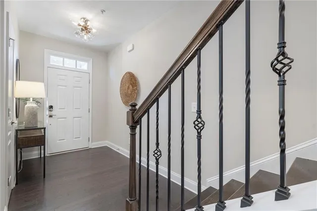 a view of an entryway with wooden floor