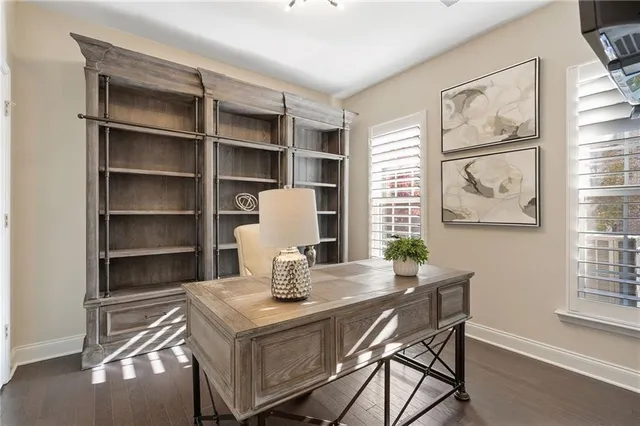 a view of a dining room with a table and chairs