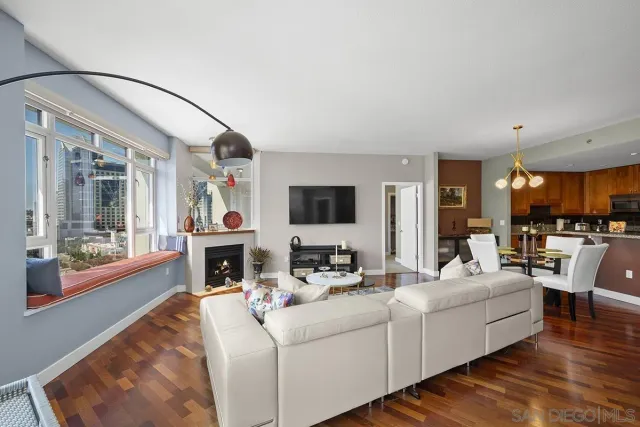 a living room with fireplace furniture and a flat screen tv
