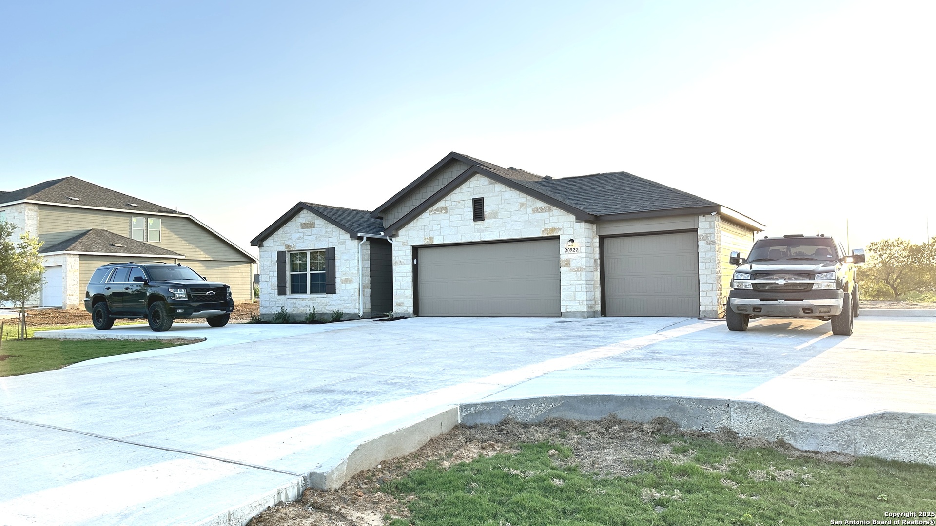 20929 Pleasanton Road San Antonio, TX 78264 - Photo 6 of 51 a front view of a house with a yard and garage