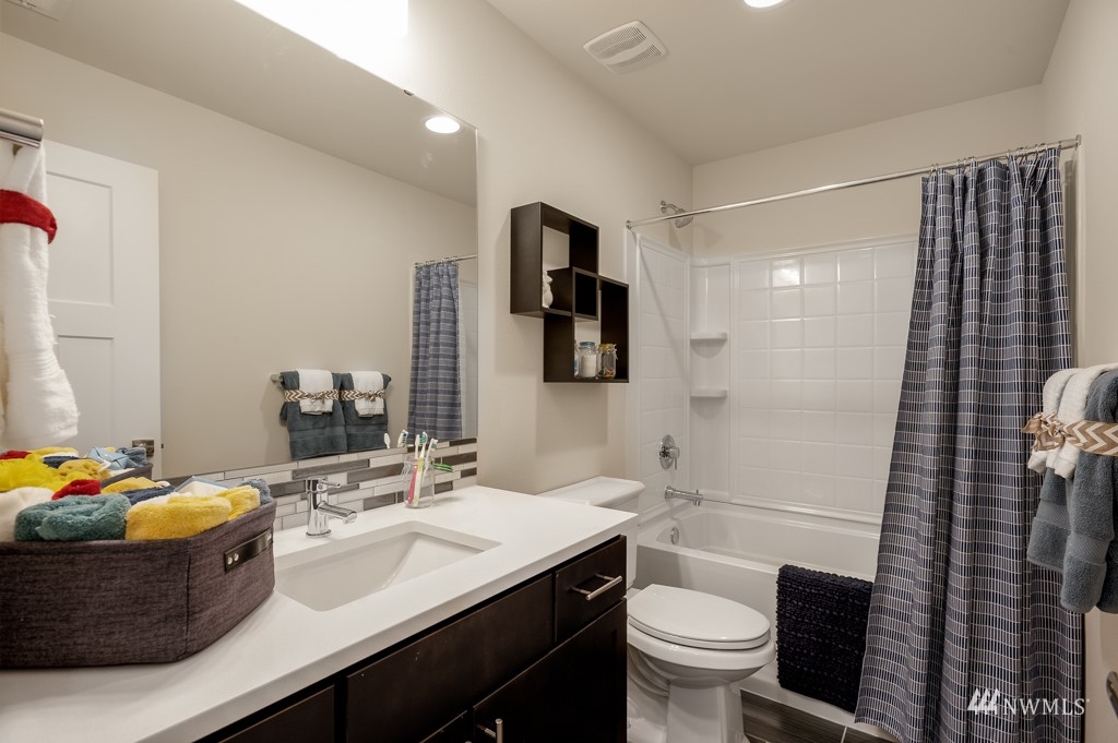 620 215th Street Southeast, Unit RM6 Bothell, WA 98021 - Photo 12 of 28 a bathroom with a sink toilet and shower